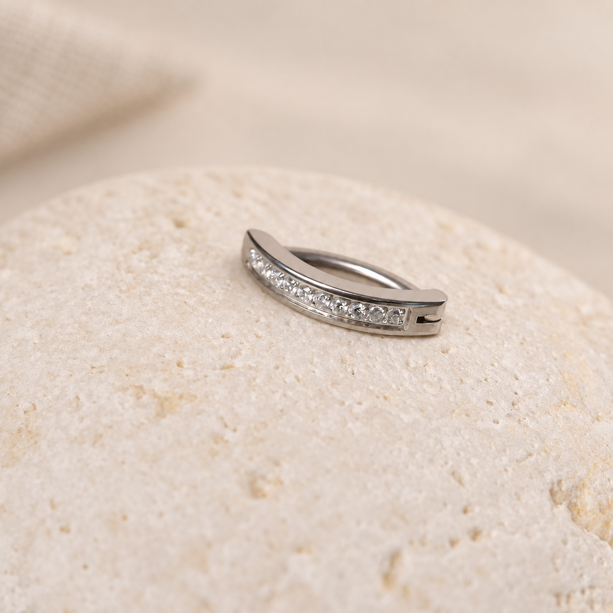 Silver-tone curved belly jewellery with clear stones - side detail