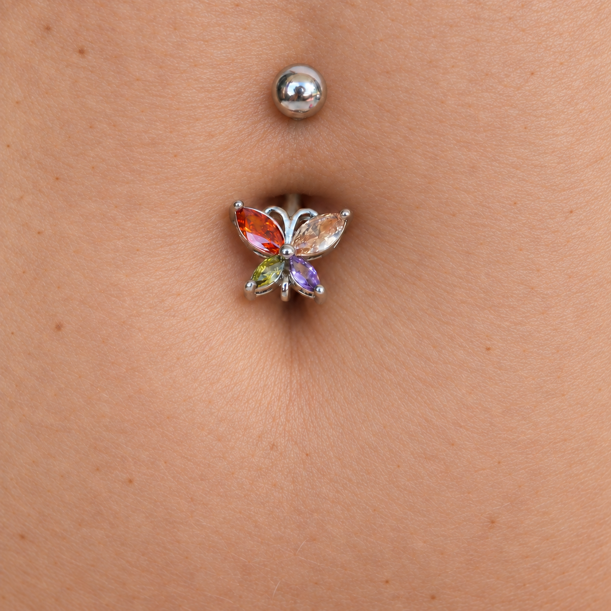 Multicolour butterfly belly bar worn at the navel