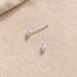 Clear nipple retainer with one ball removed
