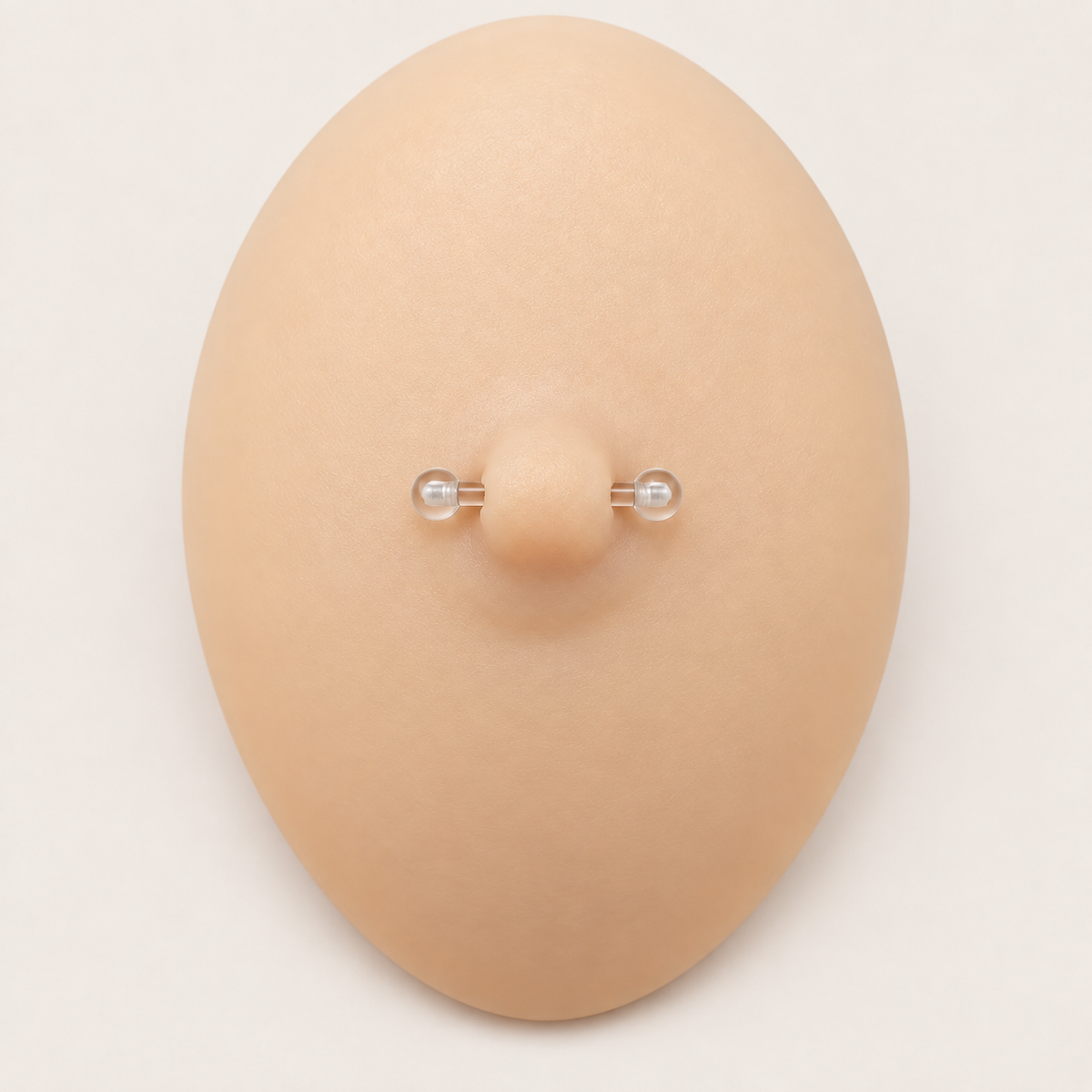 Clear nipple retainer displayed on a silicone demonstration model