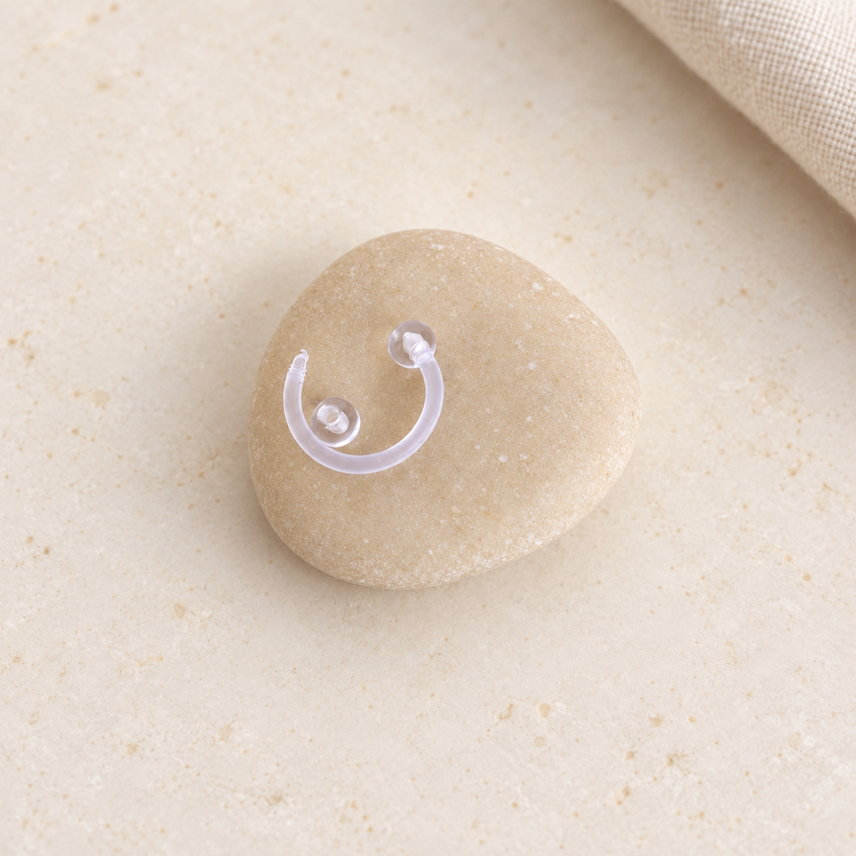 Clear horseshoe piercing retainer, angled view