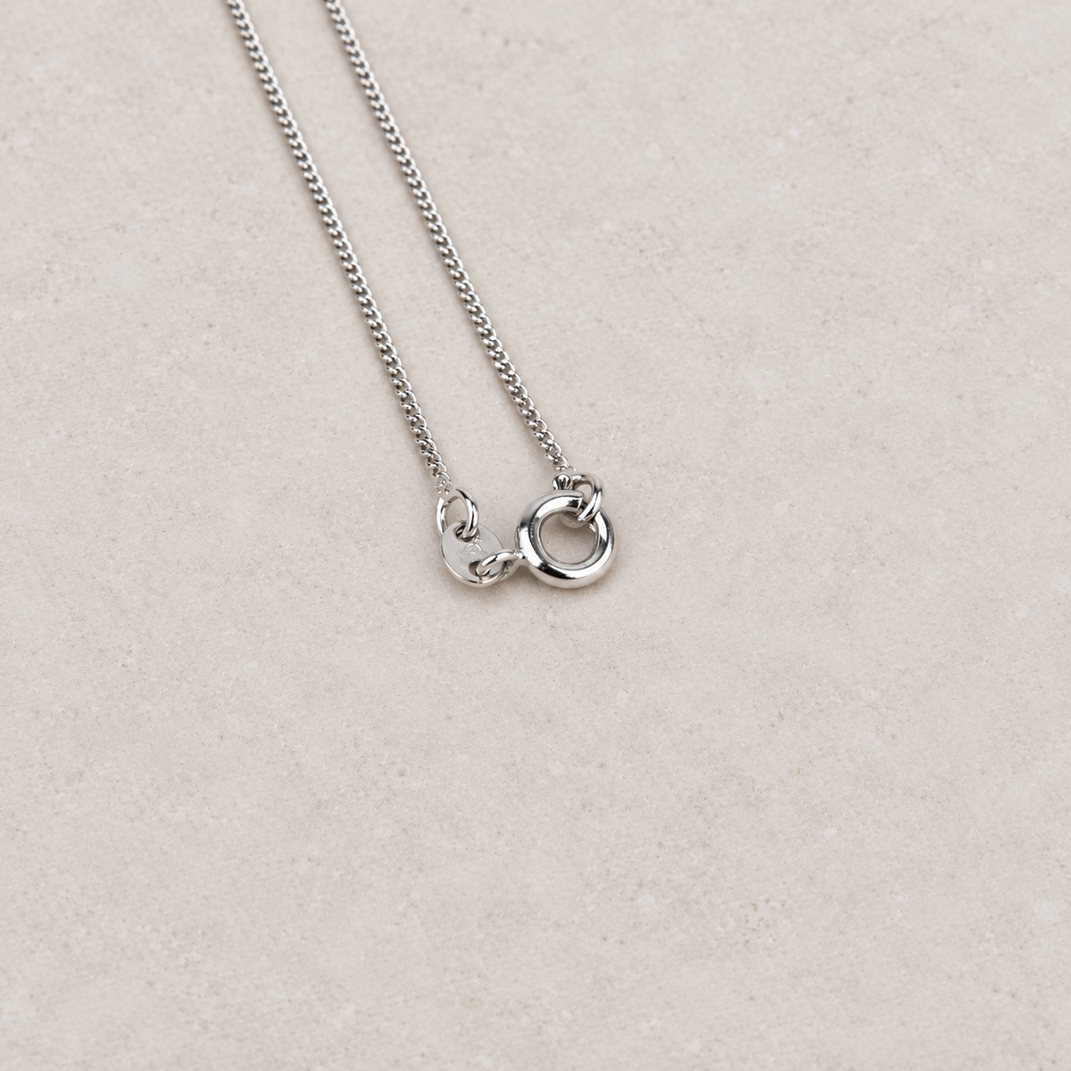 Solitaire necklace chain clasp detail