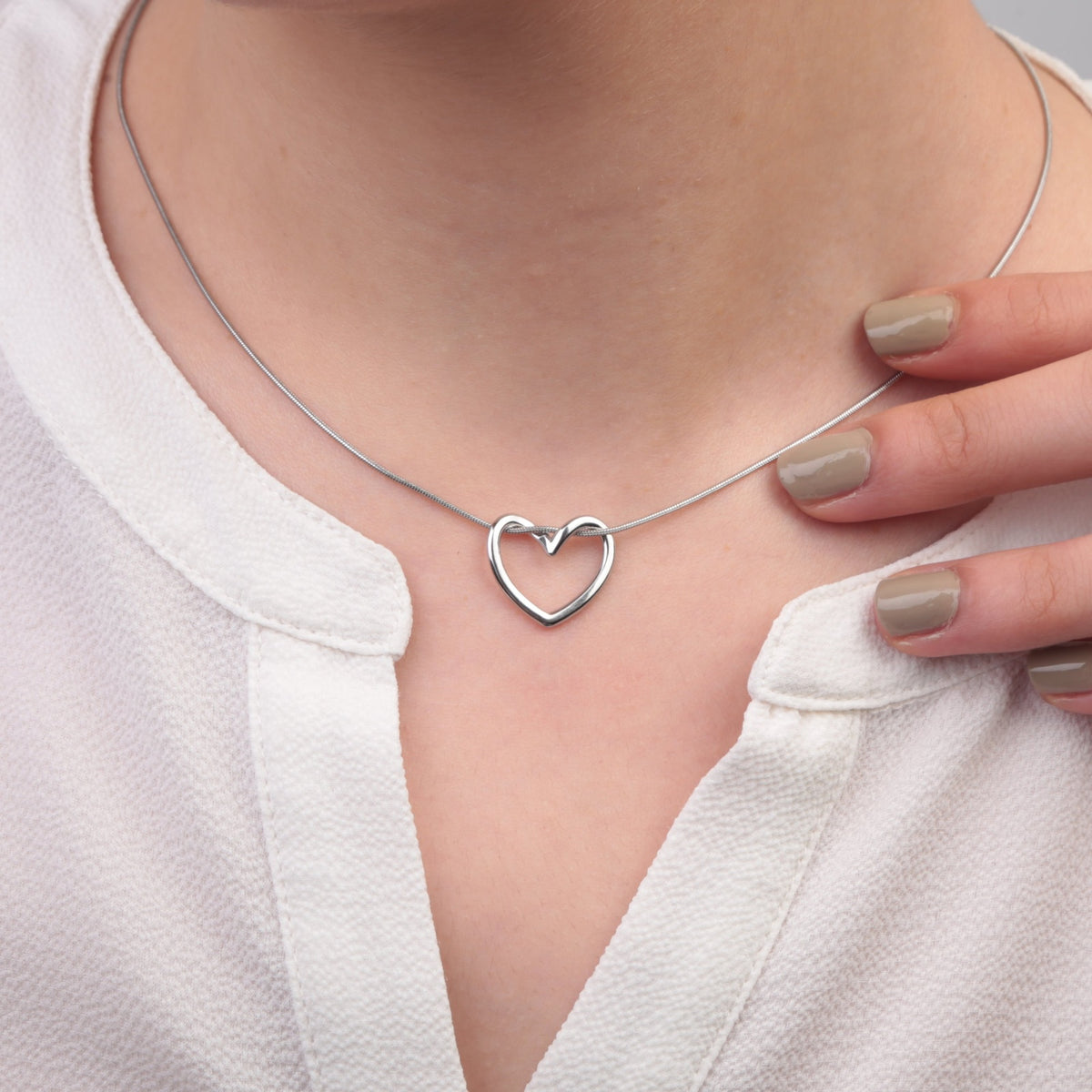 Silver heart pendant necklace - worn on model
