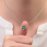 Silver clover pendant close-up while worn