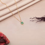 Gold clover pendant necklace detail
