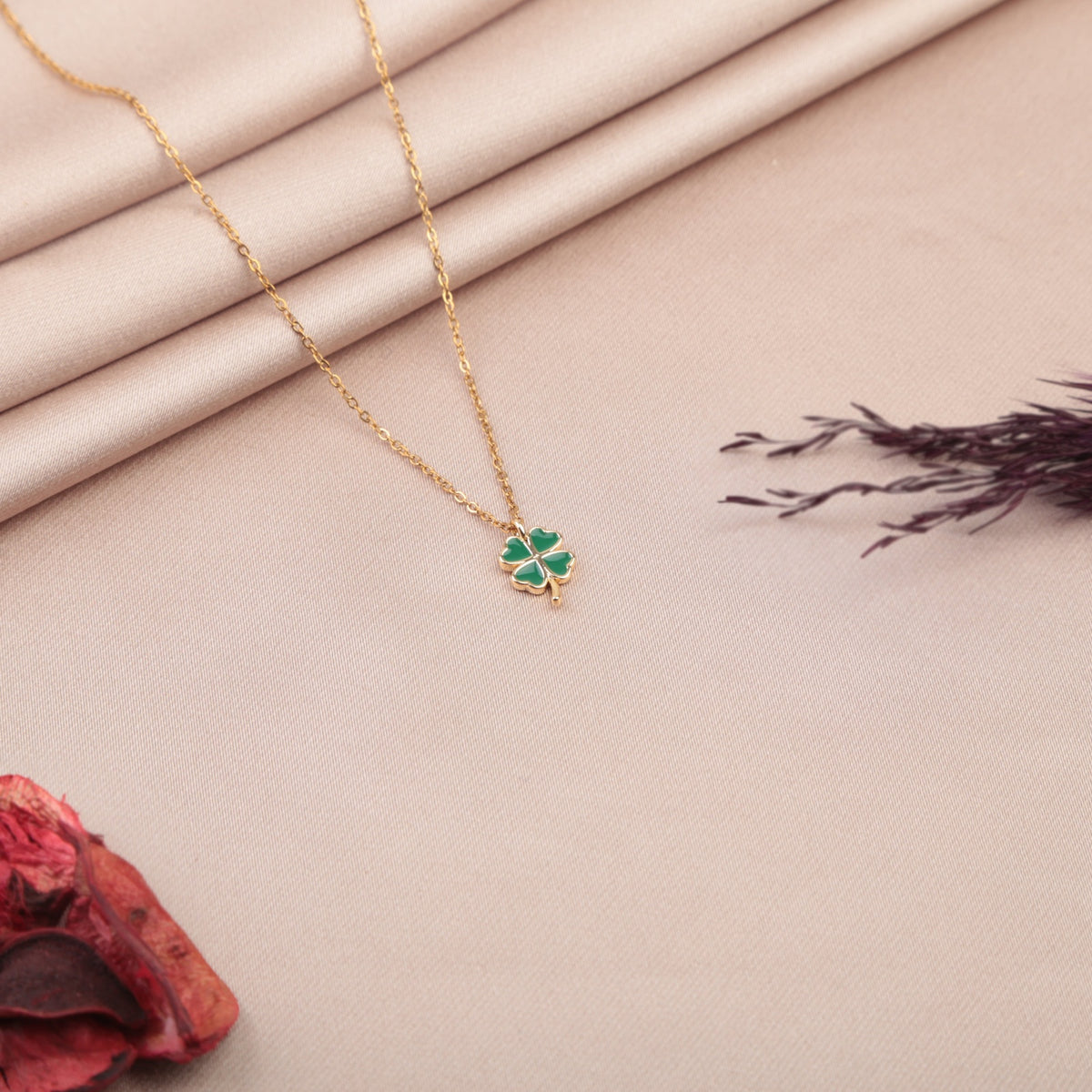 Gold clover pendant necklace detail