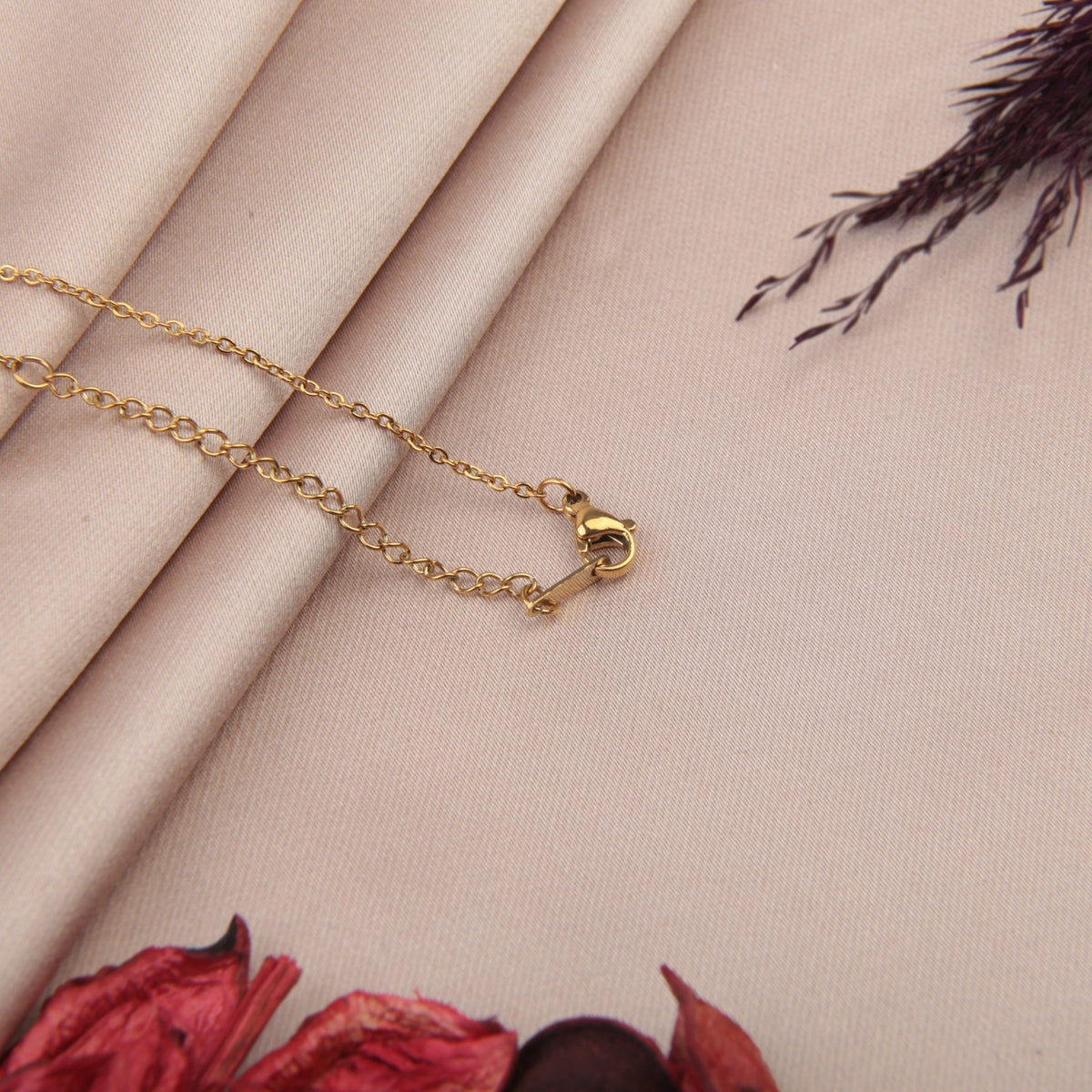 Gold necklace chain clasp and extension detail