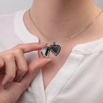 Silver heart photo locket necklace opened while worn