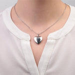 Silver heart photo locket necklace worn