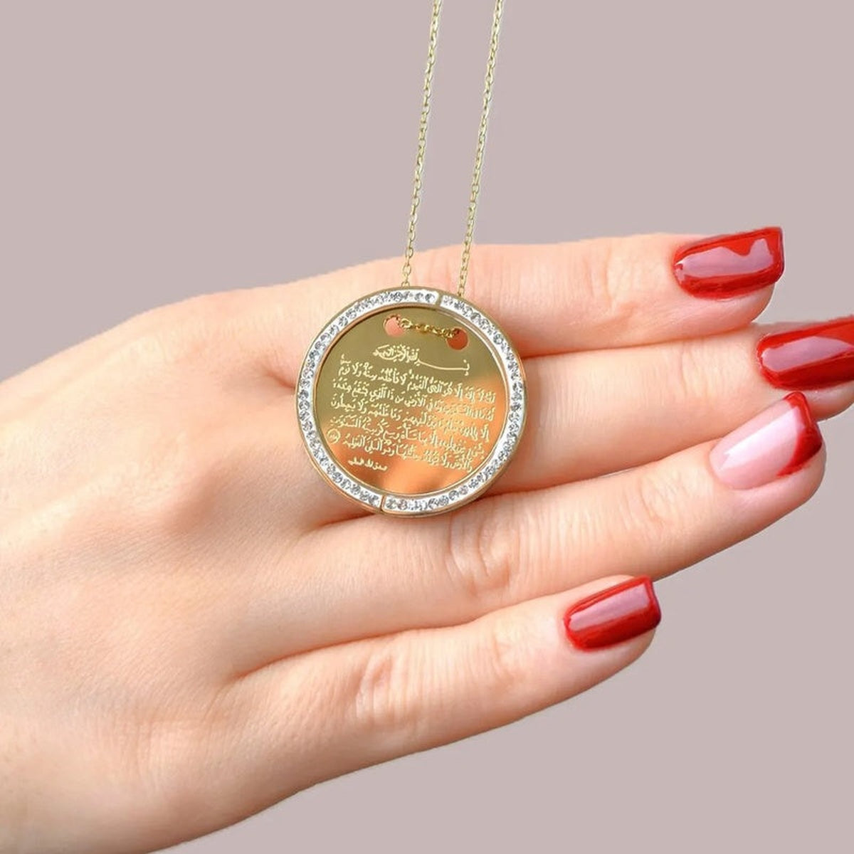 Gold Ayatul Kursi pendant inscription close-up