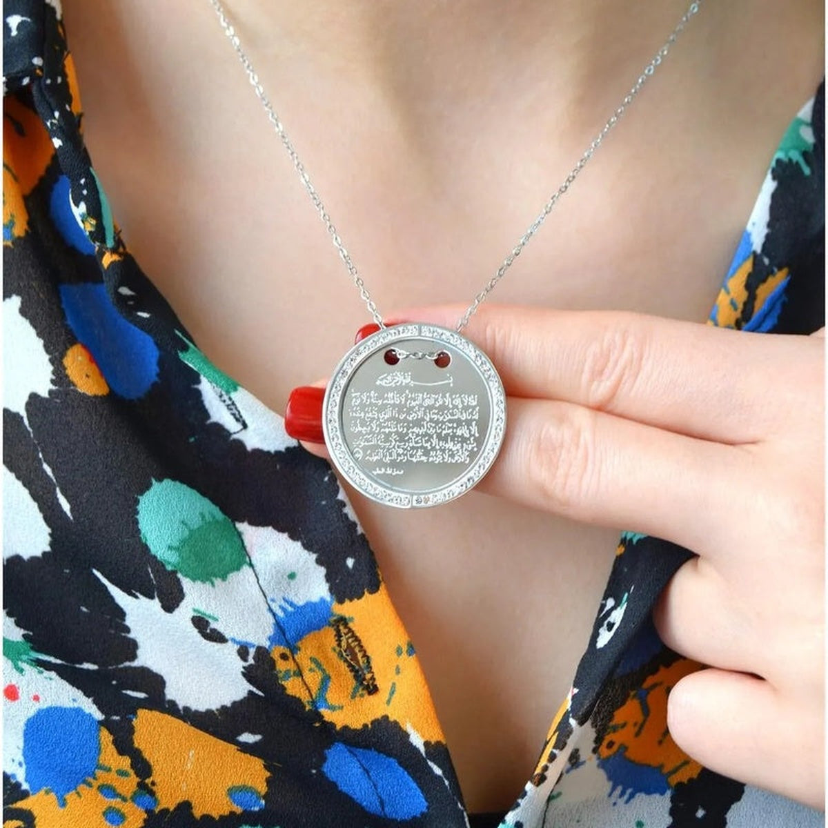 Silver Ayatul Kursi pendant necklace worn, close-up