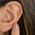 Gold zircon letter B piercing stud shown on the ear