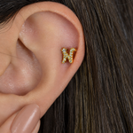 Gold zircon letter N piercing stud shown on the ear