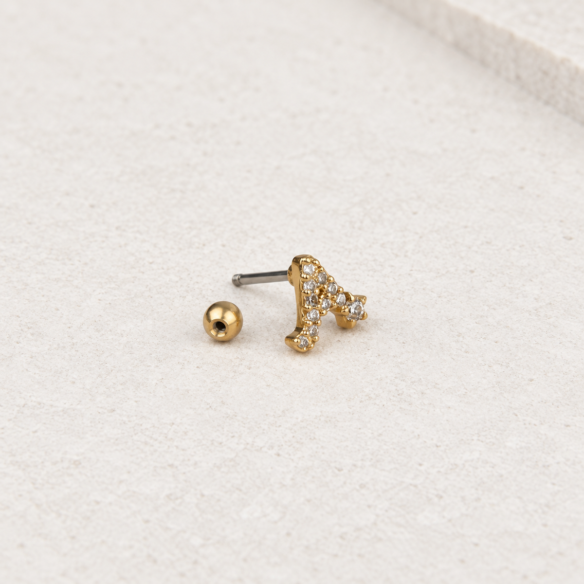 Gold zircon letter A piercing stud, product detail