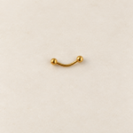 Gold curved barbell with ball ends