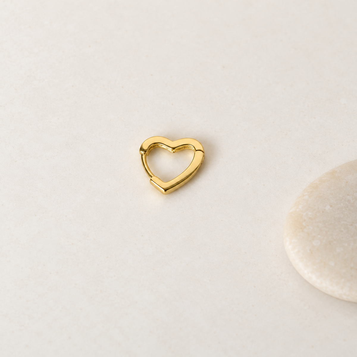 Gold heart-shaped hoop earring, front product view — Toku LONDON
