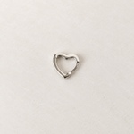 Silver heart-shaped hoop earring, product view — Toku LONDON