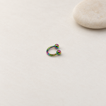Rainbow ball-end horseshoe barbell on a neutral background
