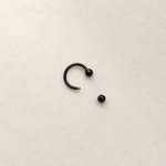 Black horseshoe barbell with one ball removed