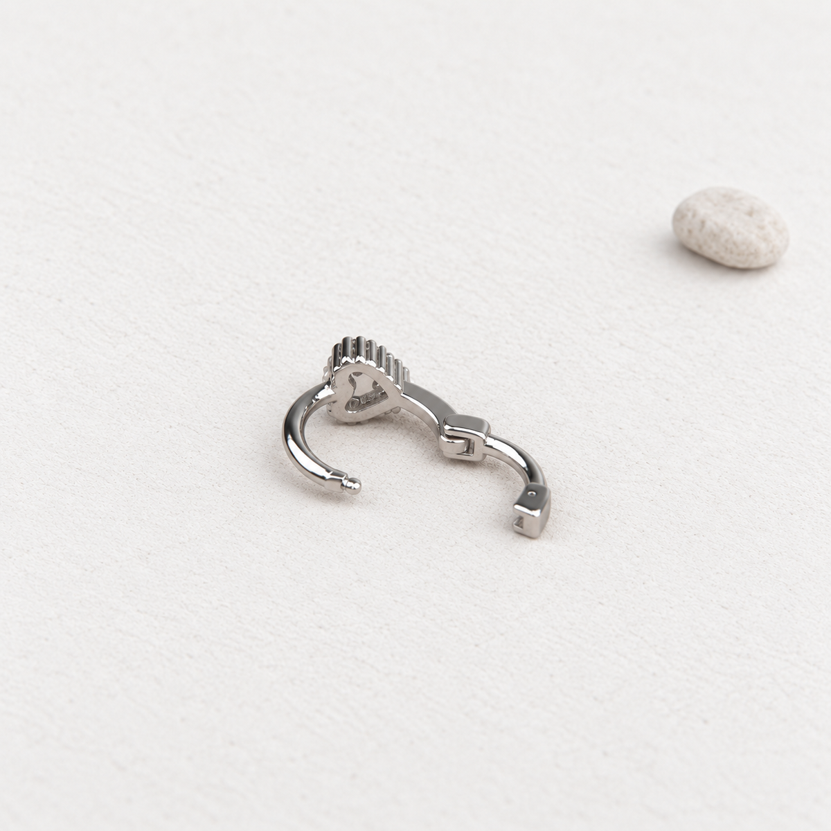 Silver heart hoop earring rear clasp detail