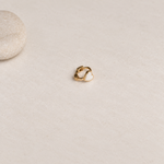 Gold hoop ring with a white heart