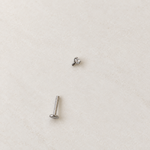 Silver solitaire piercing stud with top removed, showing the post — Toku LONDON