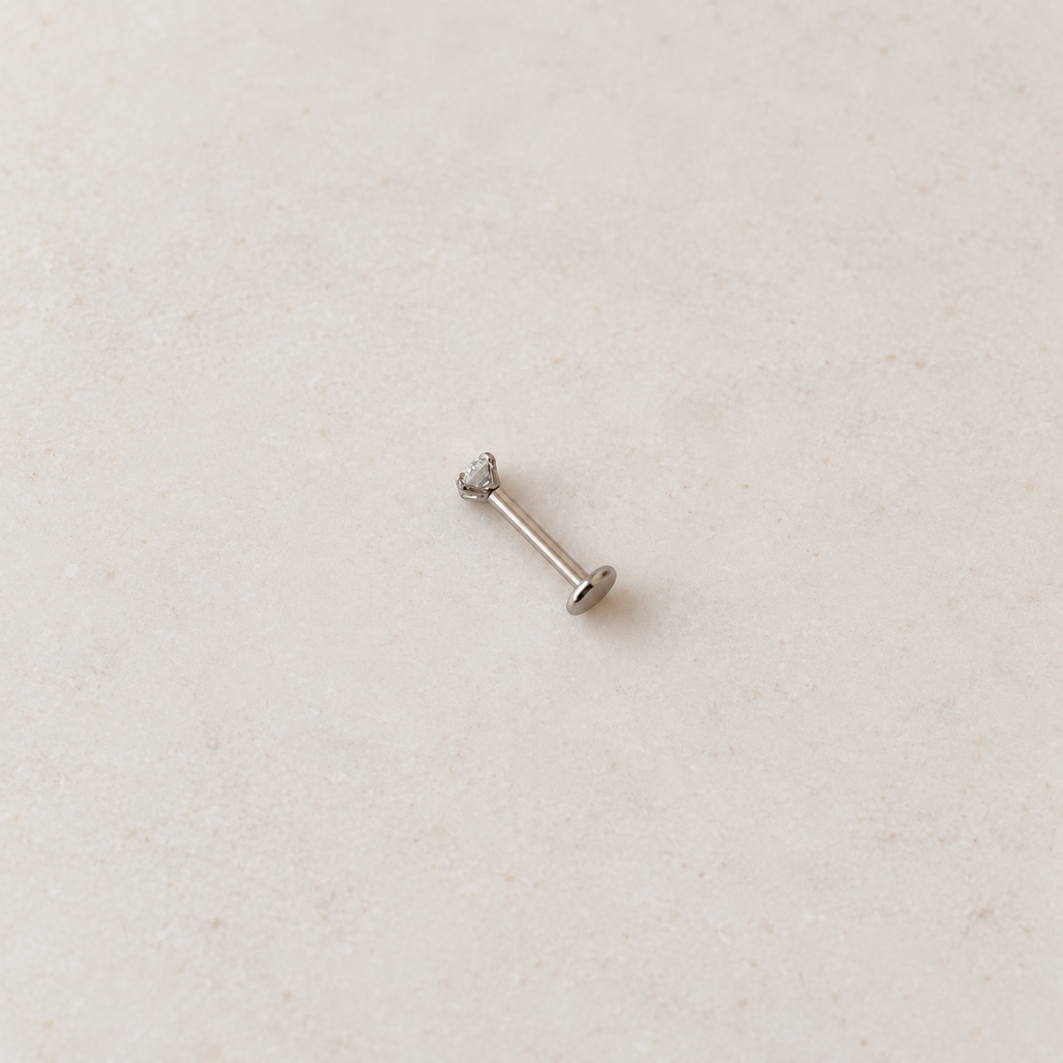 Silver solitaire flat-back piercing stud, product view — Toku LONDON