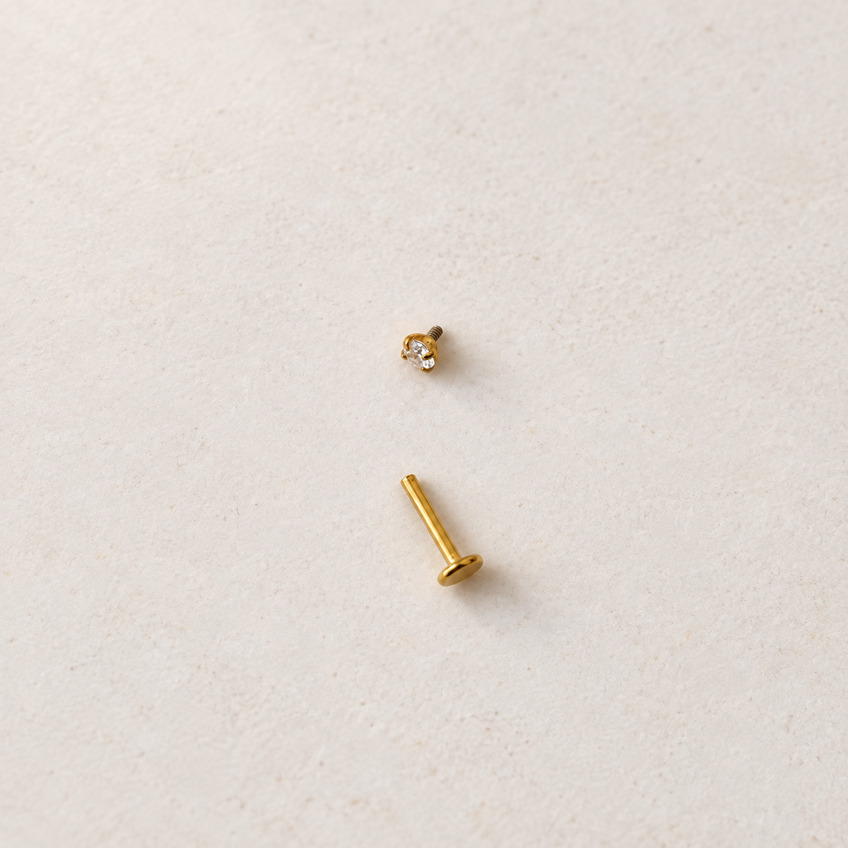 Gold solitaire piercing stud with top removed, showing the post — Toku LONDON