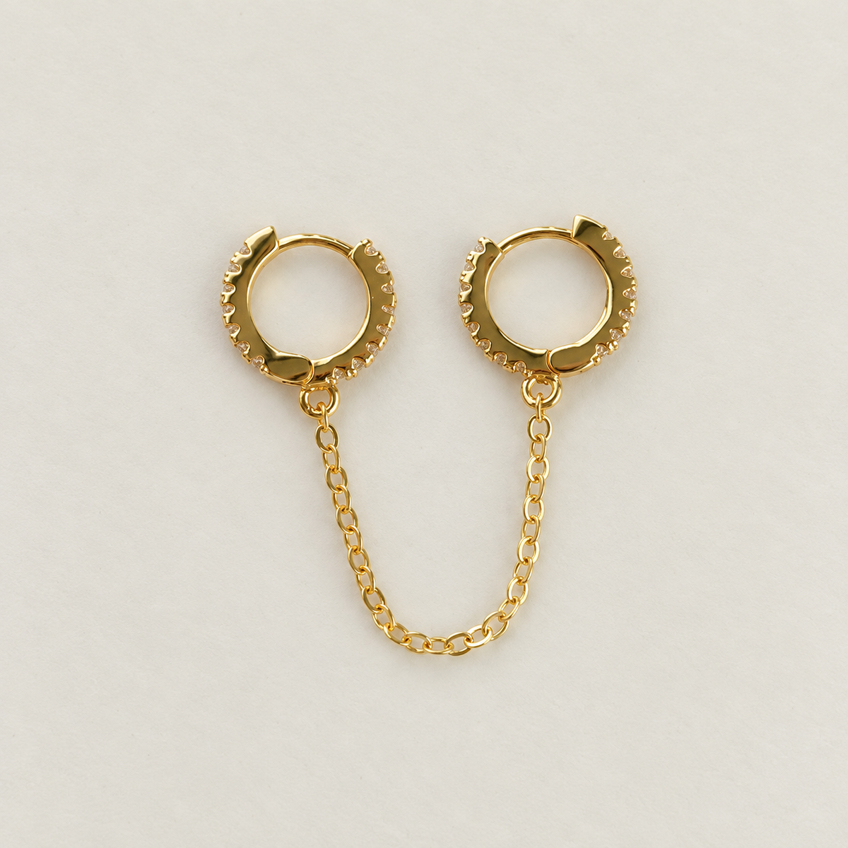 Gold double hoop ear chain earring, front view