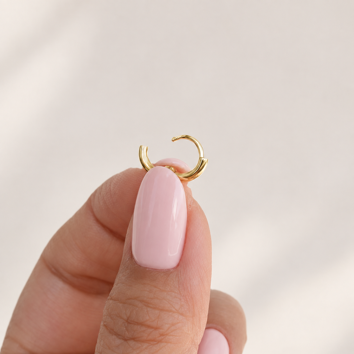 Gold hoop ring showing the open hinged clasp