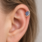 Navy blue and gold planet hoop earring worn on the upper ear — Toku LONDON