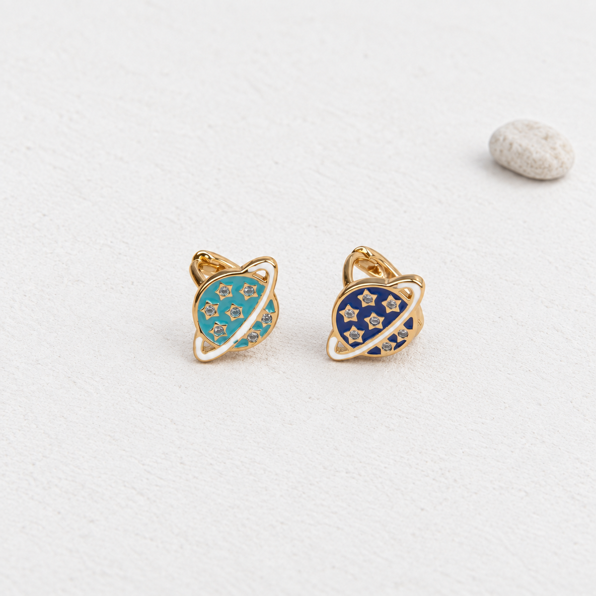 Turquoise blue and navy blue planet hoop earrings shown together — Toku LONDON
