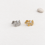 Gold and silver leaf hoop earrings, angled view