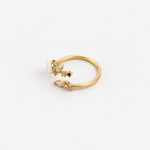 Magnolia flower adjustable ring with blue stones, angled view