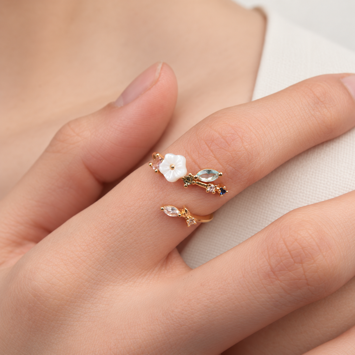 Magnolia flower adjustable ring worn on a hand