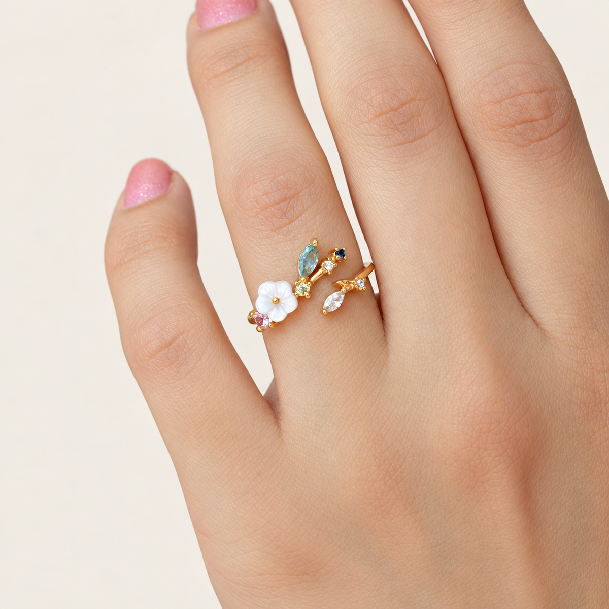 Magnolia flower adjustable ring worn on a hand