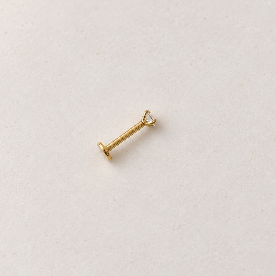 Gold solitaire flat-back piercing stud, product view — Toku LONDON