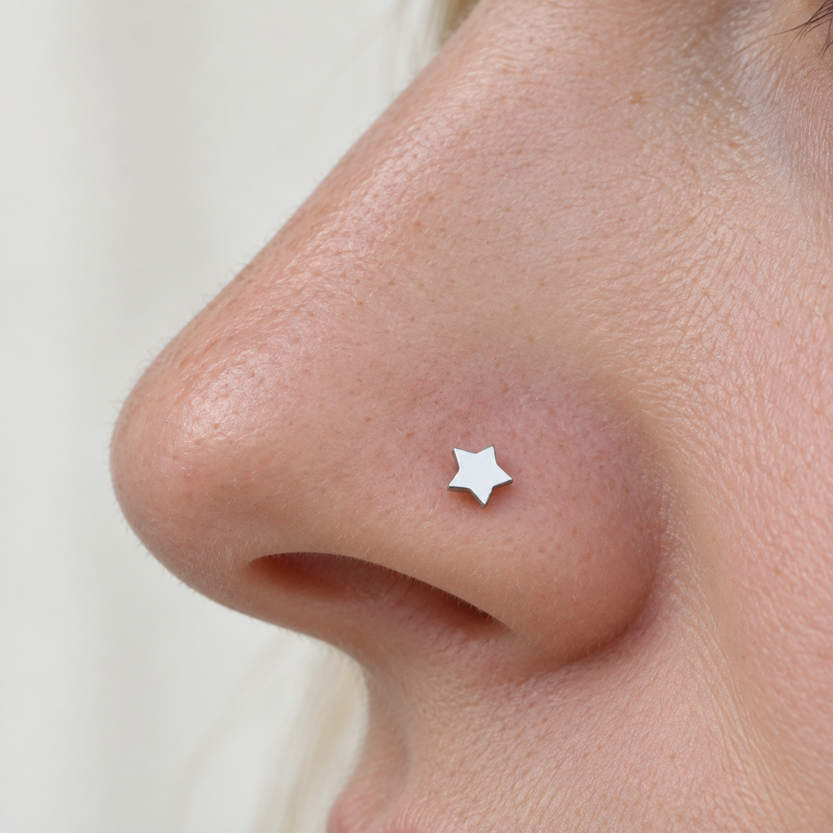 Bone Star Nose Stud in Gold or Silver, Stainless Steel, Pair - product view