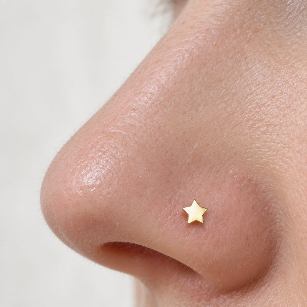 Bone Star Nose Stud in Gold or Silver, Stainless Steel, Pair - product view